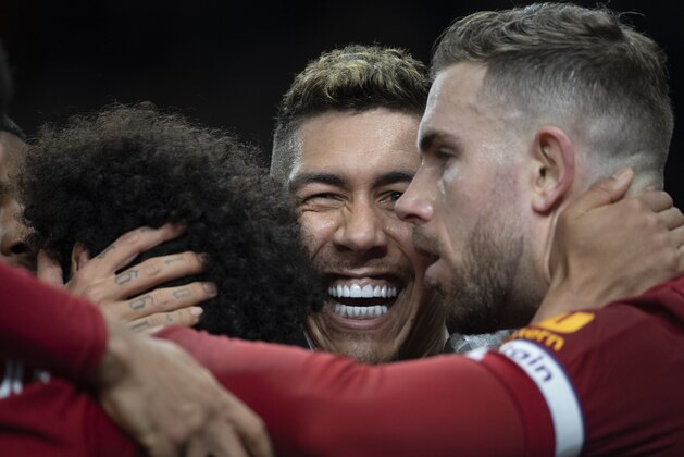 LONDON, ENGLAND - JANUARY 11: Roberto Firmino (centre) celebrates with Mo Salah and Jordan Henderson after scoring the winning goal for Liverpool FC during the Premier League match between Tottenham Hotspur and Liverpool FC at Tottenham Hotspur Stadium on January 11, 2020 in London, United Kingdom. (Photo by Visionhaus) LONDON, ENGLAND - JANUARY 11: Roberto Firmino (centre) celebrates with Mo Salah and Jordan Henderson after scoring the winning goal for Liverpool FC during the Premier League match between Tottenham Hotspur and Liverpool FC at Tottenham Hotspur Stadium on January 11, 2020 in London, United Kingdom. (Photo by Visionhaus)