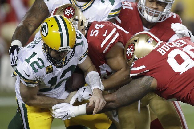 Green Bay Packers quarterback Aaron Rodgers (12) fumbles the ball while sacked by San Francisco 49ers middle linebacker Fred Warner (54) during the first half of an NFL football game in Santa Clara, Calif., Sunday, Nov. 24, 2019. The 49ers recovered the fumble. (AP Photo/Ben Margot)