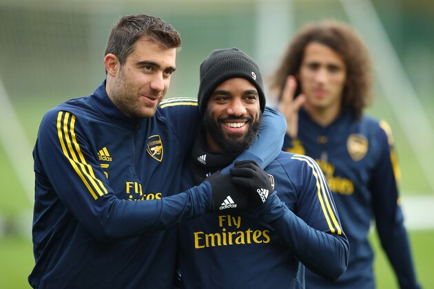 ST ALBANS, ENGLAND - NOVEMBER 27:  Sokratis Papastathopoulos jokes with team mate Alexandre Lacazette during an Arsenal training session on the eve of their UEFA Europa League match against Eintracht Frankfurt at London Colney on November 27, 2019 in St Albans, England. (Photo by Warren Little/Getty Images)