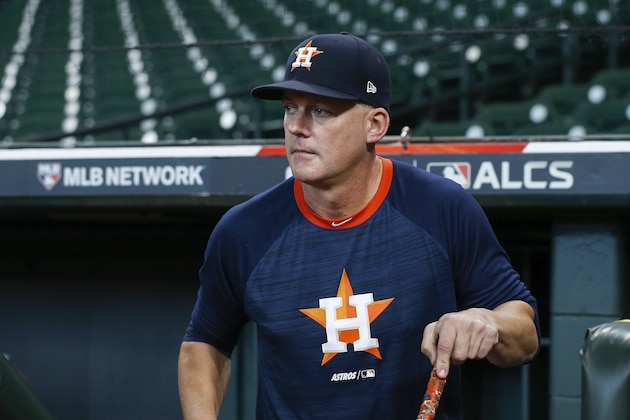 HOUSTON, TX - OCTOBER 19:  Manager AJ Hinch #14 of the Houston Astros walks out of the dugout before Game Six of the League Championship Series against the New York Yankees at Minute Maid Park on October 19, 2019 in Houston, Texas.  (Photo by Tim Warner/Getty Images)