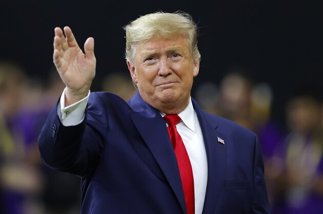 NEW ORLEANS, LOUISIANA - JANUARY 13: U.S. President Donald Trump waves prior to the College Football Playoff National Championship game between the Clemson Tigers and the LSU Tigers at Mercedes Benz Superdome on January 13, 2020 in New Orleans, Louisiana. (Photo by Kevin C. Cox/Getty Images)
