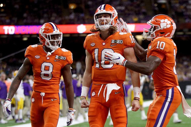 NEW ORLEANS, LOUISIANA - JANUARY 13: Trevor Lawrence #16 of the Clemson Tigers celebrates with teammates after scoring a touchdown against the LSU Tigers in the College Football Playoff National Championship game at Mercedes Benz Superdome on January 13, 2020 in New Orleans, Louisiana. (Photo by Chris Graythen/Getty Images)
