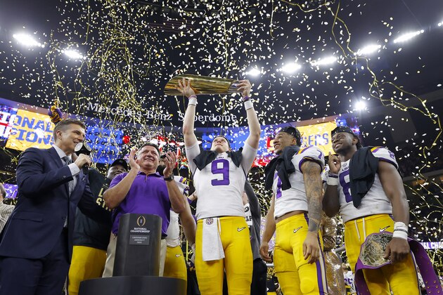 NEW ORLEANS, LOUISIANA - JANUARY 13: Head coach Ed Orgeron of the LSU Tigers, Joe Burrow #9 of the LSU Tigers and Grant Delpit #7 of the LSU Tigers celebrate with the trophy after defeating the Clemson Tigers 42-25 in the College Football Playoff National Championship game at Mercedes Benz Superdome on January 13, 2020 in New Orleans, Louisiana. (Photo by Kevin C. Cox/Getty Images)