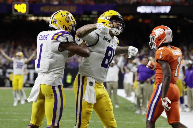 LSU tight end Thaddeus Moss, center, celebrates after scoring with wide receiver Ja'Marr Chase during the second half of a NCAA College Football Playoff national championship game against Clemson, Monday, Jan. 13, 2020, in New Orleans. (AP Photo/Sue Ogrocki) LSU tight end Thaddeus Moss, center, celebrates after scoring with wide receiver Ja'Marr Chase during the second half of a NCAA College Football Playoff national championship game against Clemson, Monday, Jan. 13, 2020, in New Orleans. (AP Photo/Sue Ogrocki)