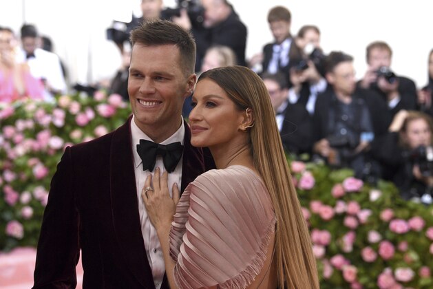 Tom Brady, left, and Gisele Bundchen attend The Metropolitan Museum of Art's Costume Institute benefit gala celebrating the opening of the