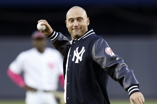 Retired New York Yankees shortstop Derek Jeter throws out the ceremonial first pitch after a ceremony retiring his number 2 in Monument Park at Yankee Stadium in New York, Sunday, May 14, 2017. (AP Photo/Kathy Willens, Pool)