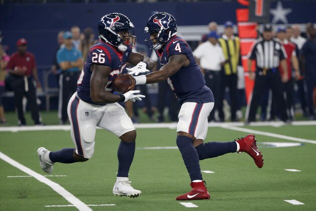 Houston Texans' Lamar Miller (26) takes the handoff from quarterback quarterback Deshaun Watson (4) during a preseason NFL football game in Arlington, Texas, Saturday, Aug. 24, 2019. (AP Photo/Ron Jenkins)