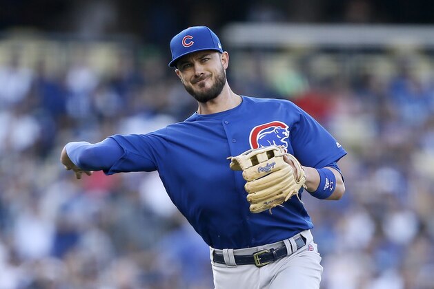 Chicago Cubs third baseman Kris Bryant throws out Los Angeles Dodgers' Austin Barnes for a ground out during the third inning of a baseball game in Los Angeles, Saturday, June 15, 2019. (AP Photo/Alex Gallardo)