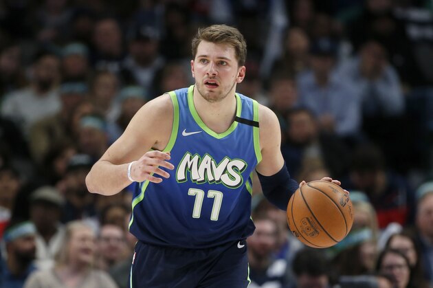 Dallas Mavericks forward Luka Doncic (77) dribbles up the court against the Philadelphia 76ers during the second half of an NBA basketball game in Dallas, Saturday, Jan 11, 2020. Dallas defeated the 76ers 109-91. (AP Photo/Michael Ainsworth)