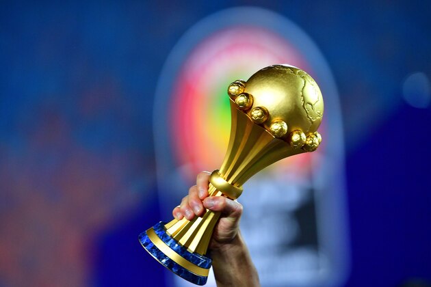 Algerian players celebrate with the trophy after winning the 2019 Africa Cup of Nations (CAN) Final football match between Senegal and Algeria at the Cairo International Stadium in Cairo on July 19, 2019. (Photo by Giuseppe CACACE / AFP)        (Photo credit should read GIUSEPPE CACACE/AFP via Getty Images)