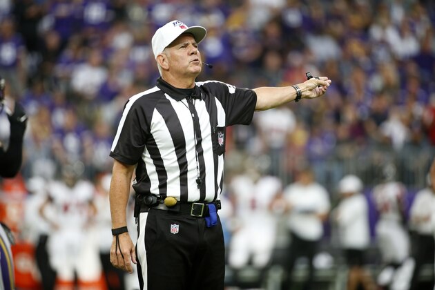 Referee Bill Vinovich signals a penalty during the first half of an NFL football game between the Minnesota Vikings and the Atlanta Falcons, Sunday, Sept. 8, 2019, in Minneapolis. (AP Photo/Bruce Kluckhohn)