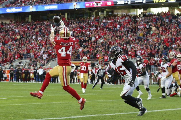 San Francisco 49ers fullback Kyle Juszczyk (44) catches a touchdown pass in front of Atlanta Falcons linebacker Deion Jones (45) during the second half of an NFL football game in Santa Clara, Calif., Sunday, Dec. 15, 2019. (AP Photo/John Hefti)