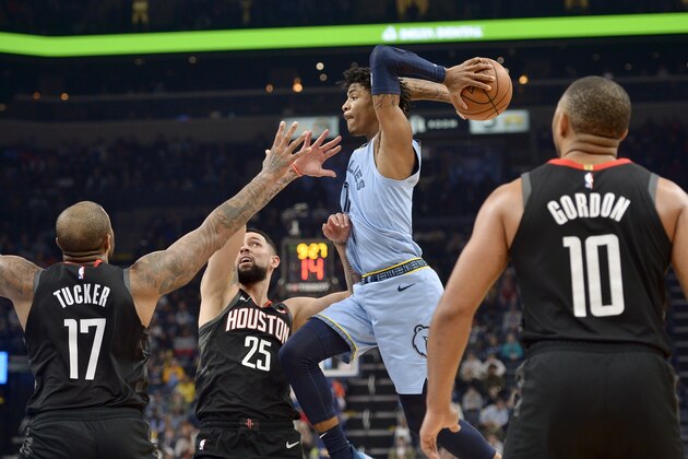 Memphis Grizzlies guard Ja Morant looks to pass the ball over Houston Rockets forward PJ Tucker (17) and guard Austin Rivers (25) during the second half of an NBA basketball game Tuesday, Jan. 14, 2020, in Memphis, Tenn. (AP Photo/Brandon Dill)