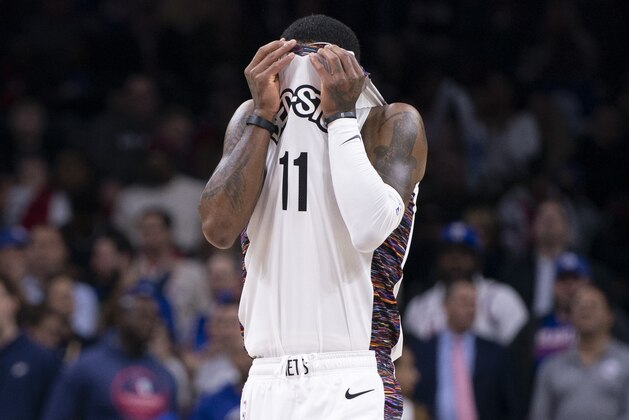 PHILADELPHIA, PA - JANUARY 15: Kyrie Irving #11 of the Brooklyn Nets wipes his face during the fourth quarter against the Philadelphia 76ers at the Wells Fargo Center on January 15, 2020 in Philadelphia, Pennsylvania. The 76ers defeated the Nets 117-106. NOTE TO USER: User expressly acknowledges and agrees that, by downloading and/or using this photograph, user is consenting to the terms and conditions of the Getty Images License Agreement. (Photo by Mitchell Leff/Getty Images)