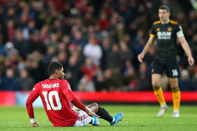 MANCHESTER, ENGLAND - JANUARY 15: Marcus Rashford of Manchester United lies injured during the FA Cup Third Round Replay match between Manchester United and Wolverhampton Wanderers at Old Trafford on January 15, 2020 in Manchester, England. (Photo by Alex Livesey/Getty Images) MANCHESTER, ENGLAND - JANUARY 15: Marcus Rashford of Manchester United lies injured during the FA Cup Third Round Replay match between Manchester United and Wolverhampton Wanderers at Old Trafford on January 15, 2020 in Manchester, England. (Photo by Alex Livesey/Getty Images)