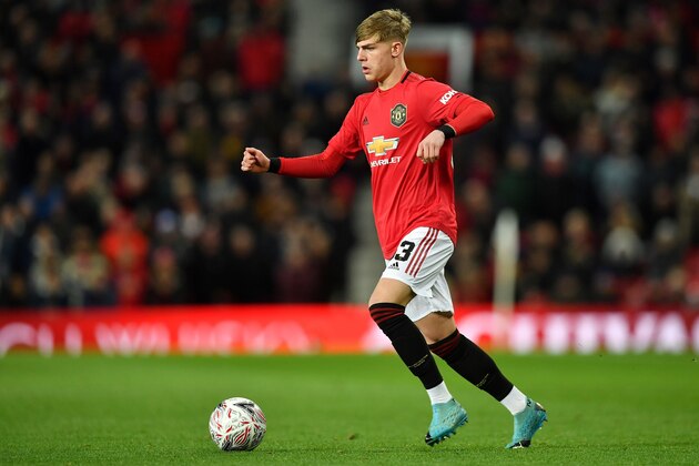 Manchester United's English defender Brandon Williams runs with the ball during the English FA Cup third round-replay football match between Manchester United and Wolverhampton Wanderers at Old Trafford in Manchester, north west England, on January 15, 2020. (Photo by Paul ELLIS / AFP) / RESTRICTED TO EDITORIAL USE. No use with unauthorized audio, video, data, fixture lists, club/league logos or 'live' services. Online in-match use limited to 120 images. An additional 40 images may be used in extra time. No video emulation. Social media in-match use limited to 120 images. An additional 40 images may be used in extra time. No use in betting publications, games or single club/league/player publications. / (Photo by PAUL ELLIS/AFP via Getty Images) Manchester United's English defender Brandon Williams runs with the ball during the English FA Cup third round-replay football match between Manchester United and Wolverhampton Wanderers at Old Trafford in Manchester, north west England, on January 15, 2020. (Photo by Paul ELLIS / AFP) / RESTRICTED TO EDITORIAL USE. No use with unauthorized audio, video, data, fixture lists, club/league logos or 'live' services. Online in-match use limited to 120 images. An additional 40 images may be used in extra time. No video emulation. Social media in-match use limited to 120 images. An additional 40 images may be used in extra time. No use in betting publications, games or single club/league/player publications. / (Photo by PAUL ELLIS/AFP via Getty Images)
