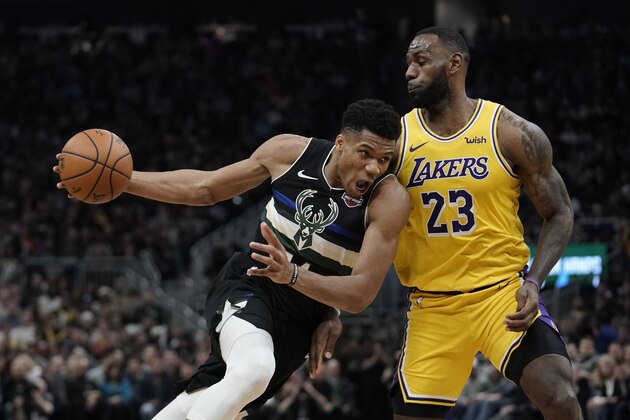 Milwaukee Bucks' Giannis Antetokounmpo tries to drive past Los Angeles Lakers' LeBron James during the second half of an NBA basketball game Thursday, Dec. 19, 2019, in Milwaukee. The Bucks won 111-104. (AP Photo/Morry Gash) Milwaukee Bucks' Giannis Antetokounmpo tries to drive past Los Angeles Lakers' LeBron James during the second half of an NBA basketball game Thursday, Dec. 19, 2019, in Milwaukee. The Bucks won 111-104. (AP Photo/Morry Gash)
