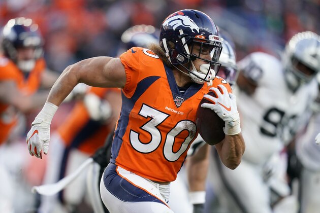 Denver Broncos running back Phillip Lindsay runs with the ball during the second half of an NFL football game against the Oakland Raiders, Sunday, Dec. 29, 2019, in Denver. (AP Photo/Jack Dempsey)