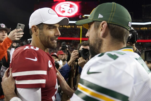 San Francisco 49ers quarterback Jimmy Garoppolo, left, greets Green Bay Packers quarterback Aaron Rodgers after an NFL football game in Santa Clara, Calif., Sunday, Nov. 24, 2019. (AP Photo/Tony Avelar)