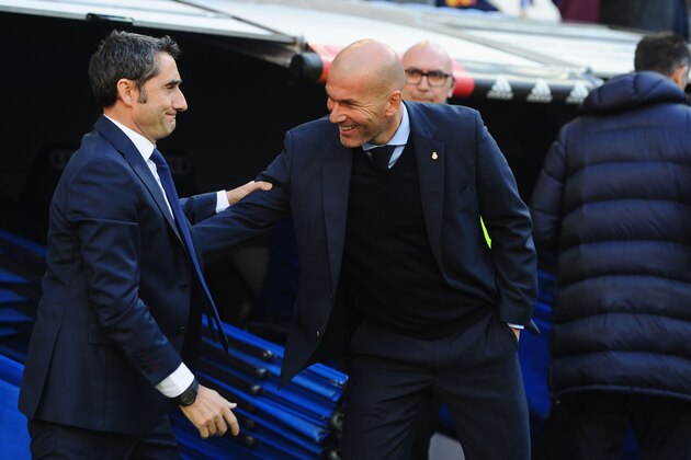 MADRID, SPAIN - DECEMBER 23:  Zinedine Zidane, Manager of Real Madrid greets Ernesto Valverde, coach of Barcelona prior to the La Liga match between Real Madrid and Barcelona at Estadio Santiago Bernabeu on December 23, 2017 in Madrid, Spain.  (Photo by Denis Doyle/Getty Images)