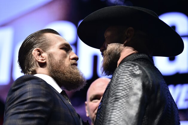 LAS VEGAS, NEVADA - JANUARY 15: (L-R) Conor McGregor of Ireland and Donald Cerrone face off during the UFC 246 press conference at Pearl Theater at the Palms Casino Resort on January 15, 2020 in Las Vegas, Nevada. (Photo by Chris Unger/Zuffa LLC via Getty Images)