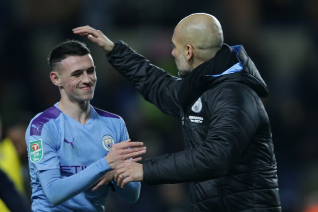 OXFORD, ENGLAND - DECEMBER 18: Phil Foden and Josep Guardiola of Manchester City after their sides 3-1 win during the Carabao Cup Quarter Final match between Oxford United and Manchester City at Kassam Stadium on December 18, 2019 in Oxford, England. (Photo by Robin Jones/Getty Images) OXFORD, ENGLAND - DECEMBER 18: Phil Foden and Josep Guardiola of Manchester City after their sides 3-1 win during the Carabao Cup Quarter Final match between Oxford United and Manchester City at Kassam Stadium on December 18, 2019 in Oxford, England. (Photo by Robin Jones/Getty Images)
