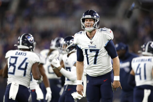 Tennessee Titans quarterback Ryan Tannehill reacts after a touchdown against the Baltimore Ravens during the second half of an NFL divisional playoff football game, Saturday, Jan. 11, 2020, in Baltimore. The Titans won 28-12. (AP Photo/Julio Cortez)