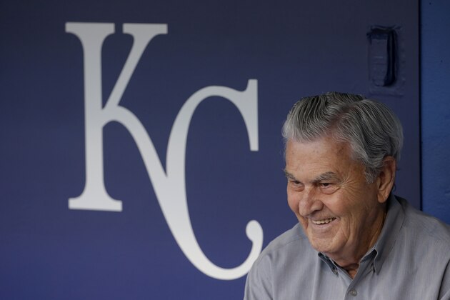 Kansas City Royals owner David Glass sits in the dugout before a baseball game between the Kansas City Royals and the Oakland Athletics Friday, April 17, 2015, in Kansas City, Mo. (AP Photo/Charlie Riedel)