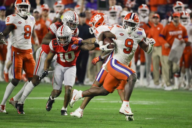 Clemson running back Travis Etienne runs for a touchdown against Ohio State during the second half of the Fiesta Bowl NCAA college football playoff semifinal Saturday, Dec. 28, 2019, in Glendale, Ariz. (AP Photo/Rick Scuteri)
