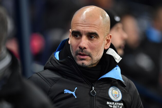 Manchester City's Spanish manager Pep Guardiola arrives for the English FA Cup third round football match between Manchester City and Port Vale at the Etihad Stadium in Manchester, north west England, on January 4, 2020. (Photo by Paul ELLIS / AFP) / RESTRICTED TO EDITORIAL USE. No use with unauthorized audio, video, data, fixture lists, club/league logos or 'live' services. Online in-match use limited to 120 images. An additional 40 images may be used in extra time. No video emulation. Social media in-match use limited to 120 images. An additional 40 images may be used in extra time. No use in betting publications, games or single club/league/player publications. /  (Photo by PAUL ELLIS/AFP via Getty Images)