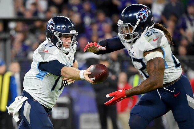 BALTIMORE, MARYLAND - JANUARY 11: Ryan Tannehill #17 of the Tennessee Titans hands the ball off to Derrick Henry #22 during the AFC Divisional Playoff game against the Baltimore Ravens at M&T Bank Stadium on January 11, 2020 in Baltimore, Maryland. (Photo by Will Newton/Getty Images)