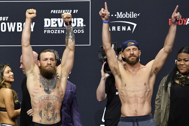 LAS VEGAS, NEVADA - JANUARY 17: (L-R) Conor McGregor of Ireland and Donald Cerrone pose for photos during the UFC 246 weigh-in at Park Theater at Park MGM on January 17, 2020 in Las Vegas, Nevada. (Photo by Jeff Bottari/Zuffa LLC)