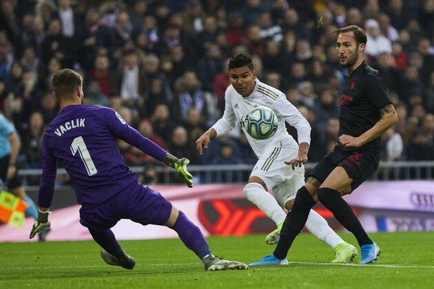 MADRID, SPAIN - JANUARY 18: Carlos Henrique Casemiro of Real Madrid and Tomas Vaclik of Sevilla FC during the Liga match between Real Madrid CF and Sevilla FC at Estadio Santiago Bernabeu on January 18, 2020 in Madrid, Spain. (Photo by Perez Meca/MB Media/Getty Images)