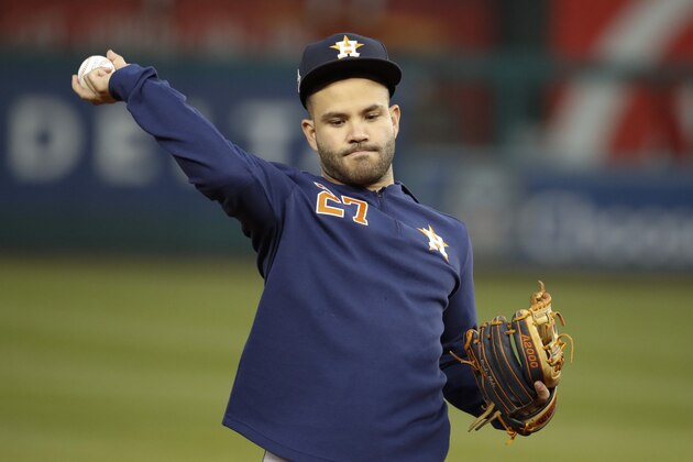 Houston Astros second baseman Jose Altuve warms up during batting practice before Game 3 of the baseball World Series against the Washington Nationals Friday, Oct. 25, 2019, in Washington.(AP Photo/Alex Brandon)