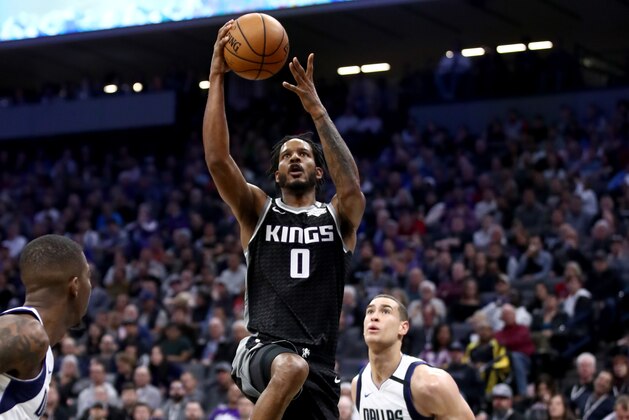 SACRAMENTO, CALIFORNIA - JANUARY 15:  Trevor Ariza #0 of the Sacramento Kings goes up for a shot on Dwight Powell #7 of the Dallas Mavericks at Golden 1 Center on January 15, 2020 in Sacramento, California.  NOTE TO USER: User expressly acknowledges and agrees that, by downloading and or using this photograph, User is consenting to the terms and conditions of the Getty Images License Agreement.  (Photo by Ezra Shaw/Getty Images)