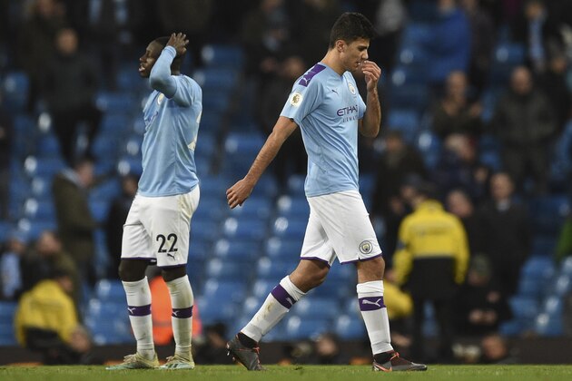 Manchester City's French defender Benjamin Mendy (L) reacts at the final whistle during the English Premier League football match between Manchester City and Crystal Palace at the Etihad Stadium in Manchester, north west England, on January 18, 2020. (Photo by Oli SCARFF / AFP) / RESTRICTED TO EDITORIAL USE. No use with unauthorized audio, video, data, fixture lists, club/league logos or 'live' services. Online in-match use limited to 120 images. An additional 40 images may be used in extra time. No video emulation. Social media in-match use limited to 120 images. An additional 40 images may be used in extra time. No use in betting publications, games or single club/league/player publications. /  (Photo by OLI SCARFF/AFP via Getty Images)