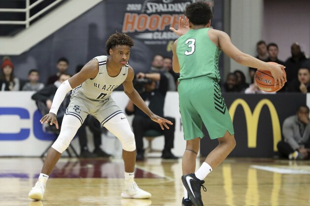 Sierra Canyon's Bronny James, left, plays defense against Dominican during a high school basketball game at the Hoophall Classic, Saturday, Jan. 18, 2020, in Springfield, Mass. (AP Photo/Gregory Payan)