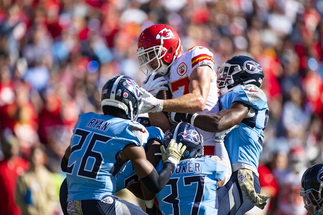 NASHVILLE, TN - NOVEMBER 10:  Travis Kelce #87 of the Kansas City Chiefs is tackled by Amani Hooker #37 of the Tennessee Titans and teammates in the first quarter at Nissan Stadium on November 10, 2019 in Nashville, Tennessee. Tennessee defeats Kansas City 35-32.  (Photo by Brett Carlsen/Getty Images)