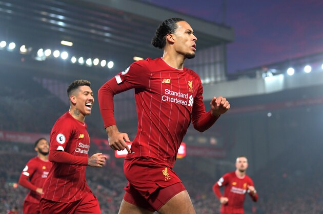 LIVERPOOL, ENGLAND - JANUARY 19: Virgil van Dijk of Liverpool celebrates after scoring his team's first goal during the Premier League match between Liverpool FC and Manchester United at Anfield on January 19, 2020 in Liverpool, United Kingdom. (Photo by Michael Regan/Getty Images)