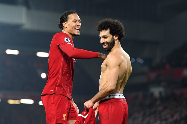 LIVERPOOL, ENGLAND - JANUARY 19: Virgil van Dijk and Mohamed Salah of Liverpool celebrate victory after the Premier League match between Liverpool FC and Manchester United at Anfield on January 19, 2020 in Liverpool, United Kingdom. (Photo by Michael Regan/Getty Images)