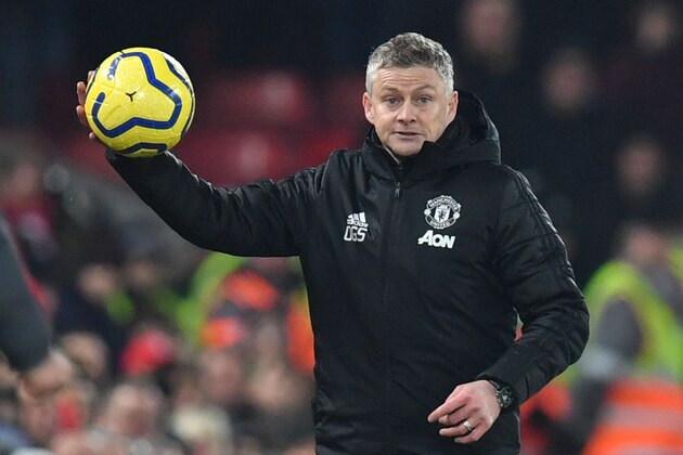 Manchester United's Norwegian manager Ole Gunnar Solskjaer throws the ball back in from the touchline during the English Premier League football match between Liverpool and Manchester United at Anfield stadium in Liverpool, north west England on January 19, 2020. (Photo by Paul ELLIS / AFP) / RESTRICTED TO EDITORIAL USE. No use with unauthorized audio, video, data, fixture lists, club/league logos or 'live' services. Online in-match use limited to 120 images. An additional 40 images may be used in extra time. No video emulation. Social media in-match use limited to 120 images. An additional 40 images may be used in extra time. No use in betting publications, games or single club/league/player publications. /  (Photo by PAUL ELLIS/AFP via Getty Images)
