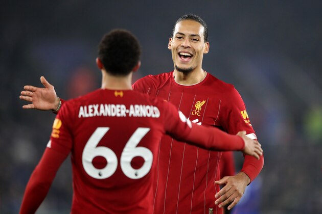 LEICESTER, ENGLAND - DECEMBER 26: Trent Alexander-Arnold of Liverpool celebrates with teammate Virgil van Dijk after scoring his team's fourth goal during the Premier League match between Leicester City and Liverpool FC at The King Power Stadium on December 26, 2019 in Leicester, United Kingdom. (Photo by Alex Pantling/Getty Images)