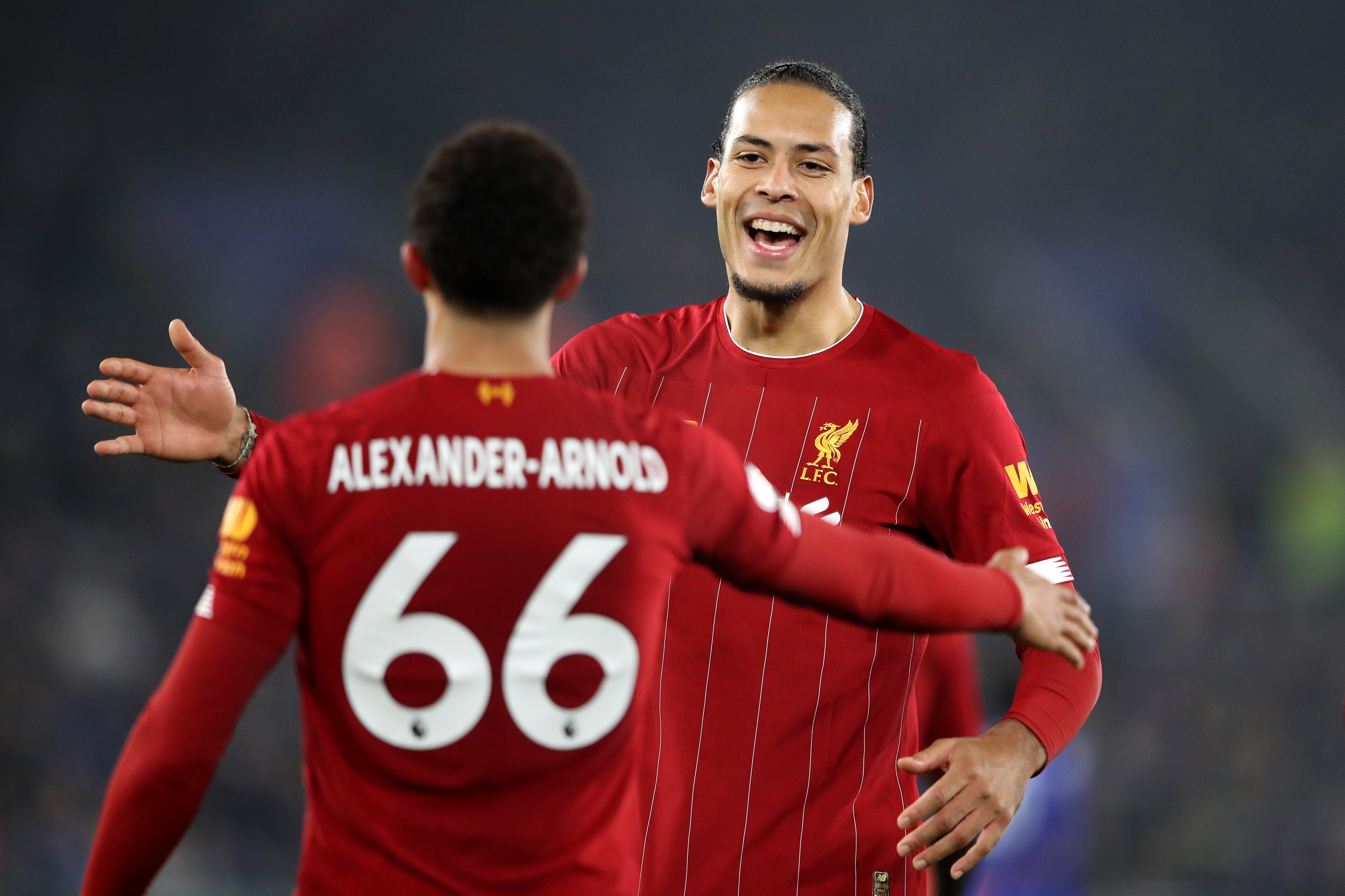 LEICESTER, ENGLAND - DECEMBER 26: Trent Alexander-Arnold of Liverpool celebrates with teammate Virgil van Dijk after scoring his team's fourth goal during the Premier League match between Leicester City and Liverpool FC at The King Power Stadium on December 26, 2019 in Leicester, United Kingdom. (Photo by Alex Pantling/Getty Images)