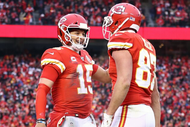 KANSAS CITY, MISSOURI - JANUARY 12:  Patrick Mahomes #15 of the Kansas City Chiefs is congratulated by his teammate Travis Kelce #87 after a third quarter touchdown against the Houston Texans in the AFC Divisional playoff game at Arrowhead Stadium on January 12, 2020 in Kansas City, Missouri. (Photo by Jamie Squire/Getty Images)