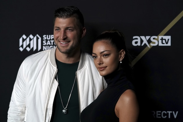 Tim Tebow and Demi-Leigh Nel-Peters pose for a photo prior to the DirecTV Super Saturday Night, Saturday, Feb. 2, 2019 in Atlanta. (Aaron Doster/AP Images for the NFL)