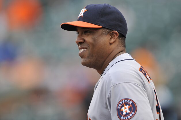 Houston Astros bench coach Eduardo Perez stands in the dugout before playing the Baltimore Orioles a baseball game, Wednesday, July 31, 2013 in Baltimore. (AP Photo/Gail Burton)
