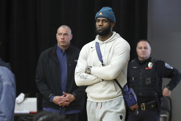 LA Lakers forward LeBron James waits for the end of the game to meet his son, Sierra Canyon's Bronny James #0 after their defeat at the hands of Paul VI in a high school basketball game at the Hoophall Classic, Monday, January 20, 2020, in Springfield, MA. (AP Photo/Gregory Payan)