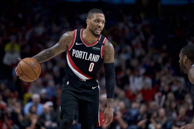 Portland Trail Blazers guard Damian Lillard brings the ball up the court against the Golden State Warriors during the second half of an NBA basketball game in Portland, Ore., Monday, Jan. 20, 2020. The Trail Blazers won 129-124 in overtime. (AP Photo/Craig Mitchelldyer)