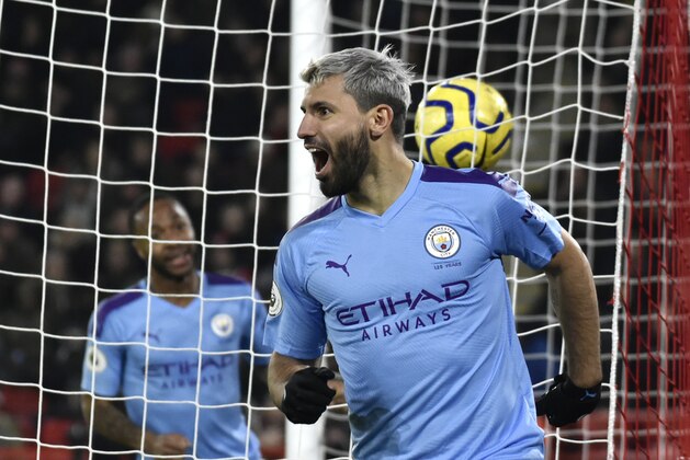 Manchester City's Sergio Aguero celebrates after scoring his side's opening goal during the English Premier League soccer match between Sheffield United and Manchester City at Bramall Lane in Sheffield, England, Tuesday, Jan. 21, 2020. (AP Photo/Rui Vieira)