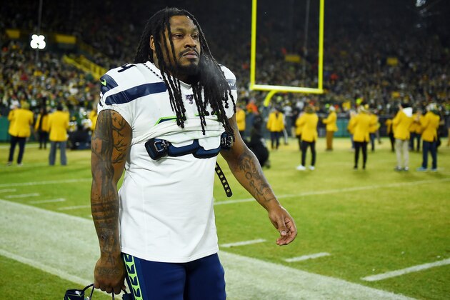 GREEN BAY, WISCONSIN - JANUARY 12: Marshawn Lynch #24 of the Seattle Seahawks looks on before the NFC Divisional Playoff game against the Green Bay Packers at Lambeau Field on January 12, 2020 in Green Bay, Wisconsin. (Photo by Stacy Revere/Getty Images) GREEN BAY, WISCONSIN - JANUARY 12: Marshawn Lynch #24 of the Seattle Seahawks looks on before the NFC Divisional Playoff game against the Green Bay Packers at Lambeau Field on January 12, 2020 in Green Bay, Wisconsin. (Photo by Stacy Revere/Getty Images)